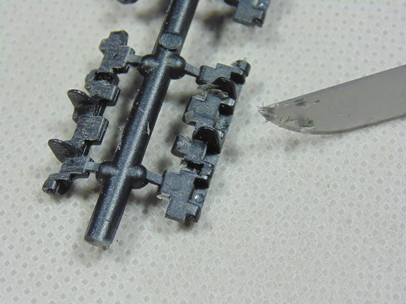 close up of rounded blade with track link