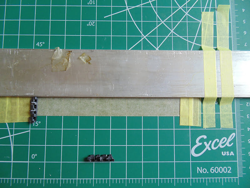 metal bar, tape and 2 links