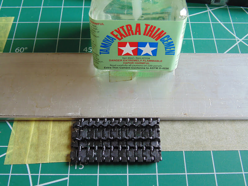 Tamiya cement on metal bar with links