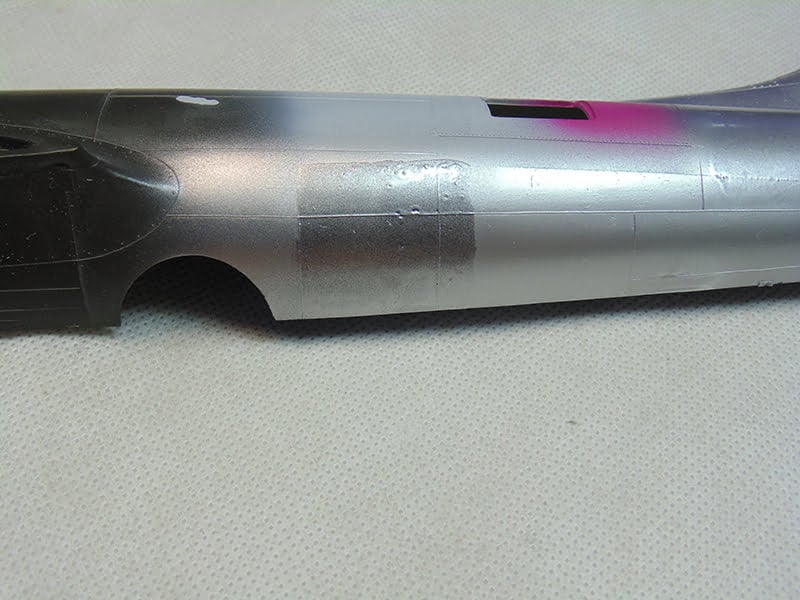 Dark Silver to The Left of The Lighter 