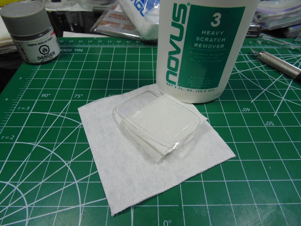 Novus Heavy Scratch Remover with towels on cutting mat