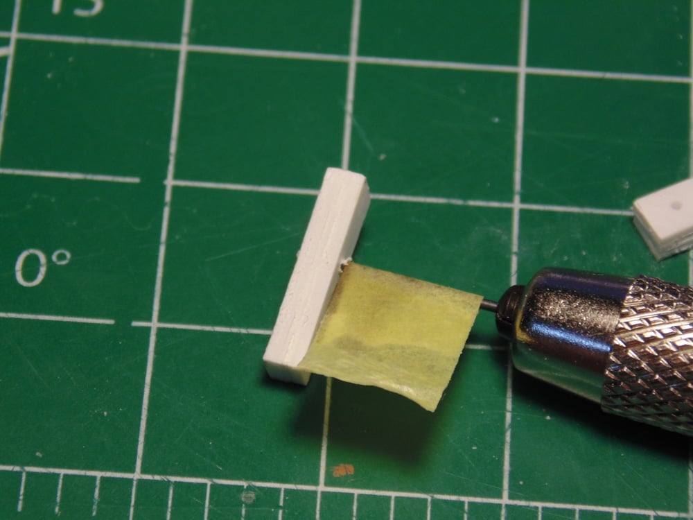 White Part with Yellow Tape on Drill Bit