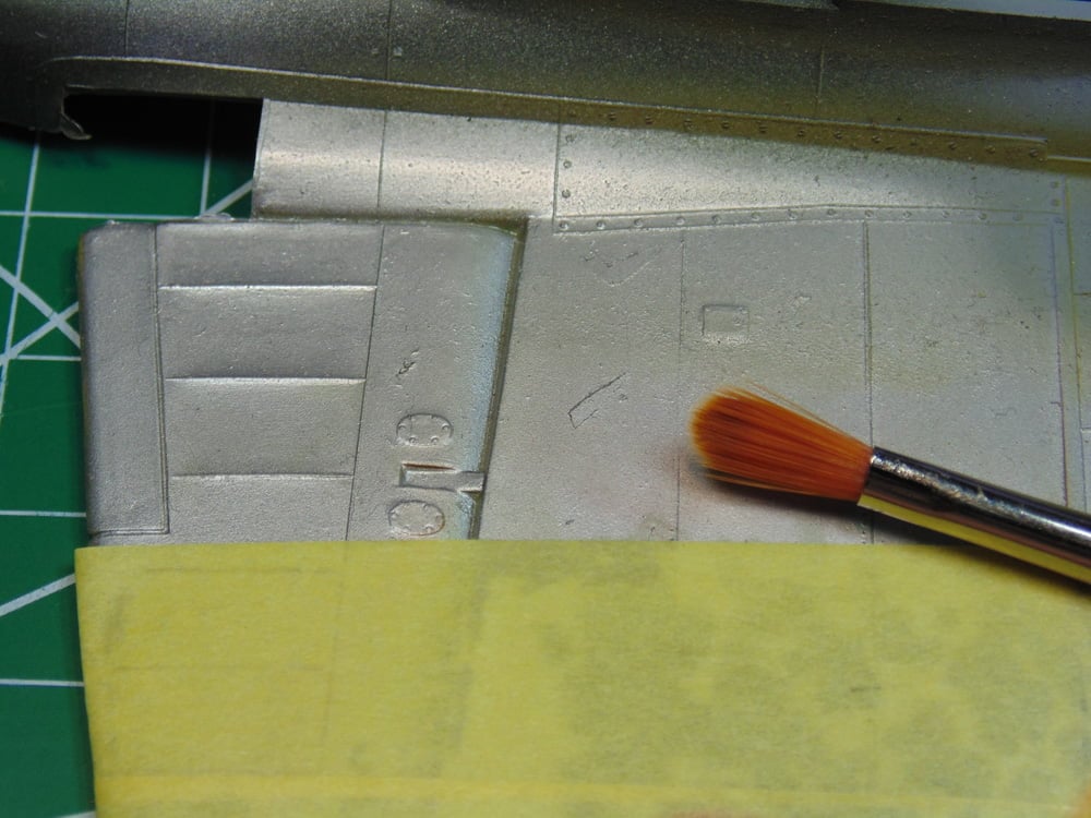 Aluminum Part with Brush and Yellow Tape