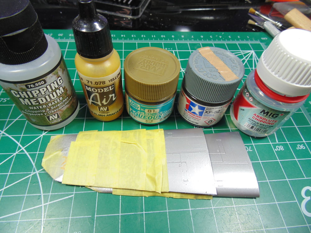 Paint and Products Above Taped Silver Parts