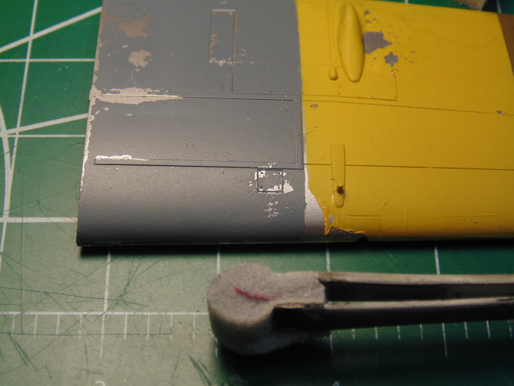 Grey and Yellow Part with Tweezers