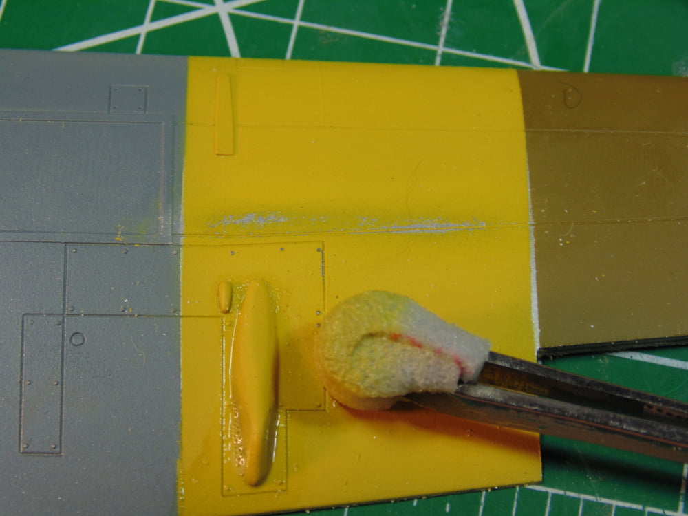 Worn Yellow Paint with Sponge on Tweezers