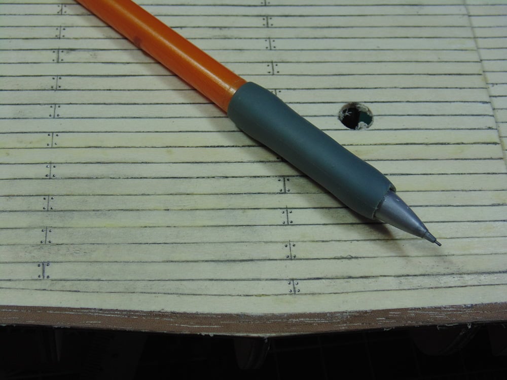 Orange Mechanical Pencil on the Simulated Decking