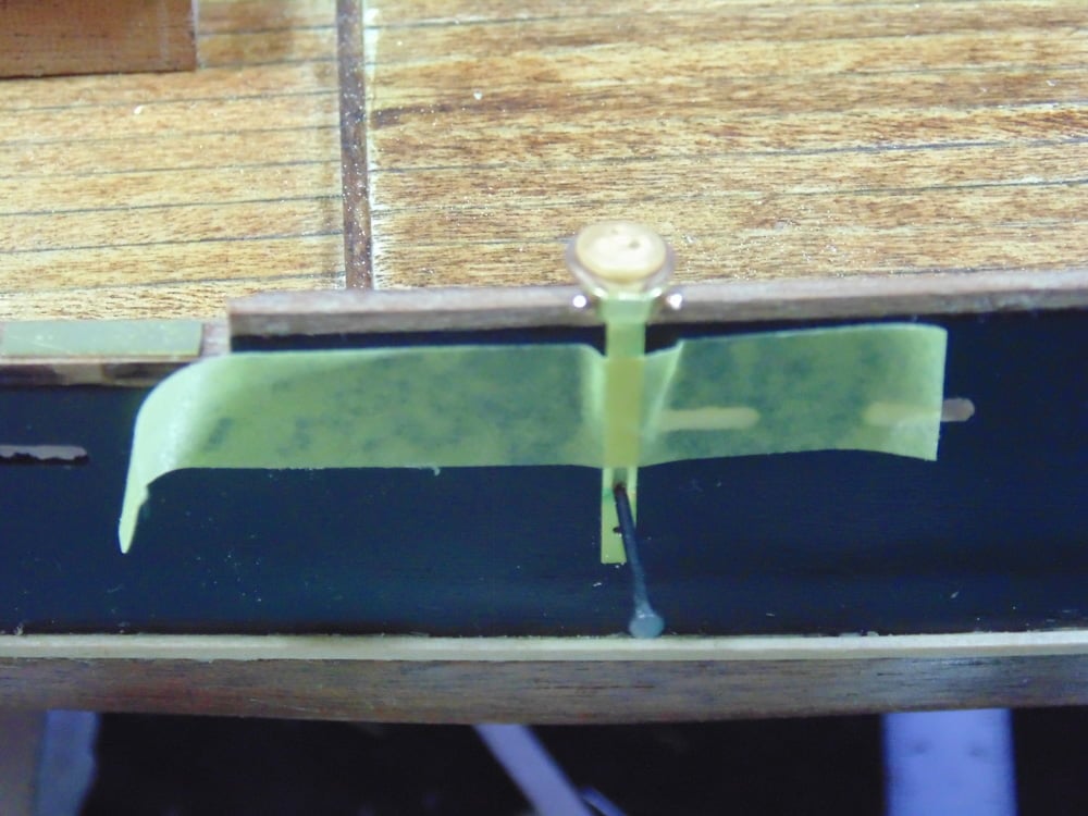 Taped tie down strap with small nail