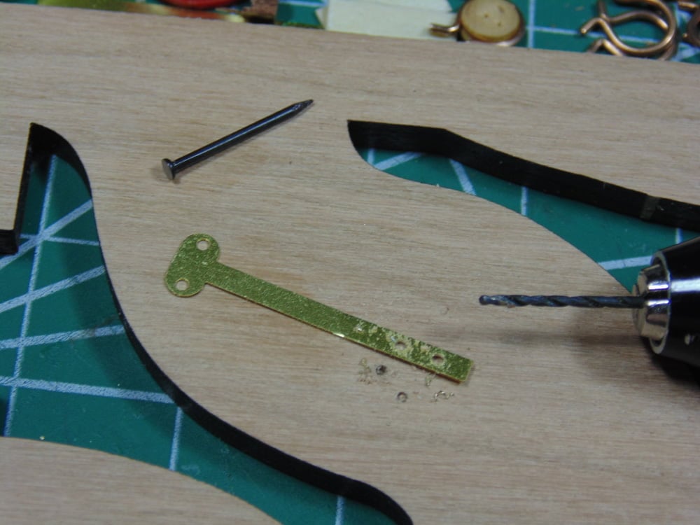 Strap with drill bit
