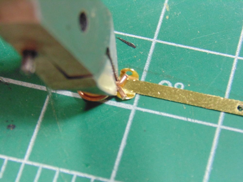A used pair of fine side cutters crimping the wings of the lugs