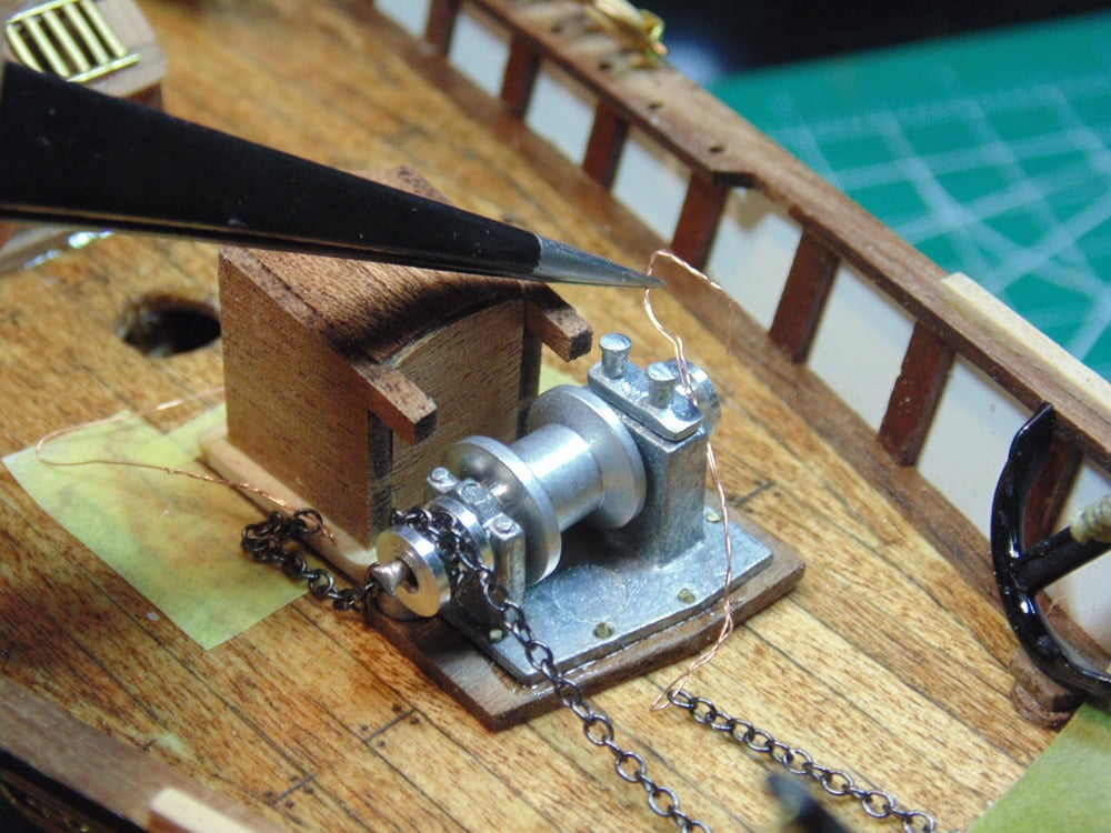 Chain with Thin Wire and Tweezers at the Chain Machine