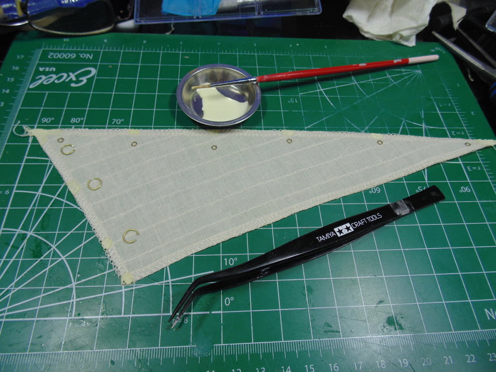 Rings on sail with tweezers