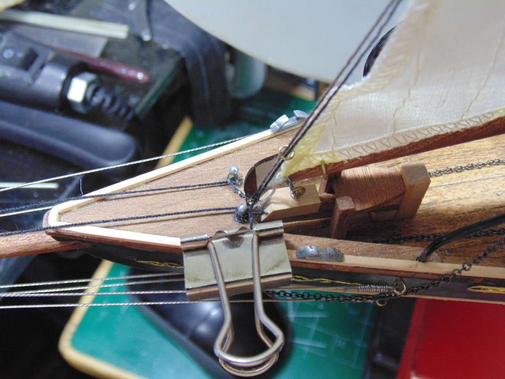 Metal clamp on bow