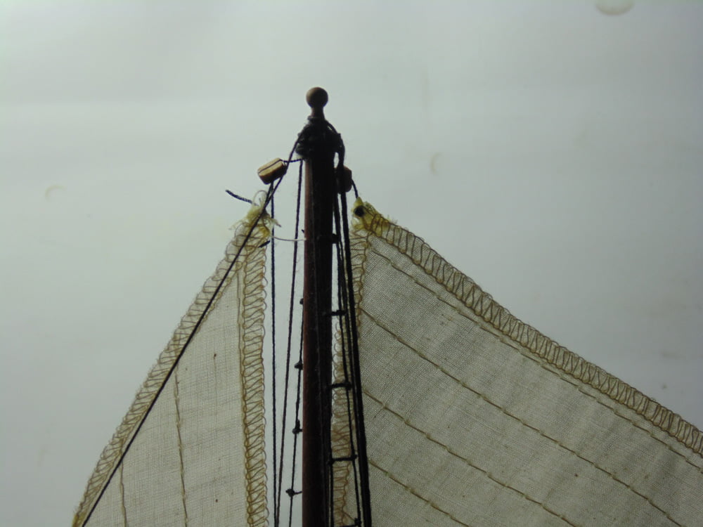 Storm sail corner rigged at the main mast tip