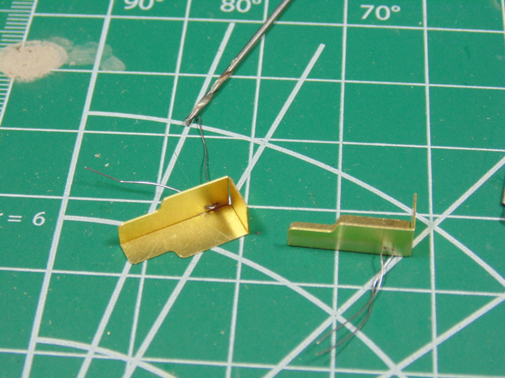 Steel wire threaded into brass parts