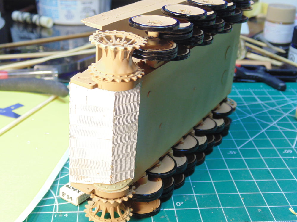 Glued wheel assemblies being straightened vertically