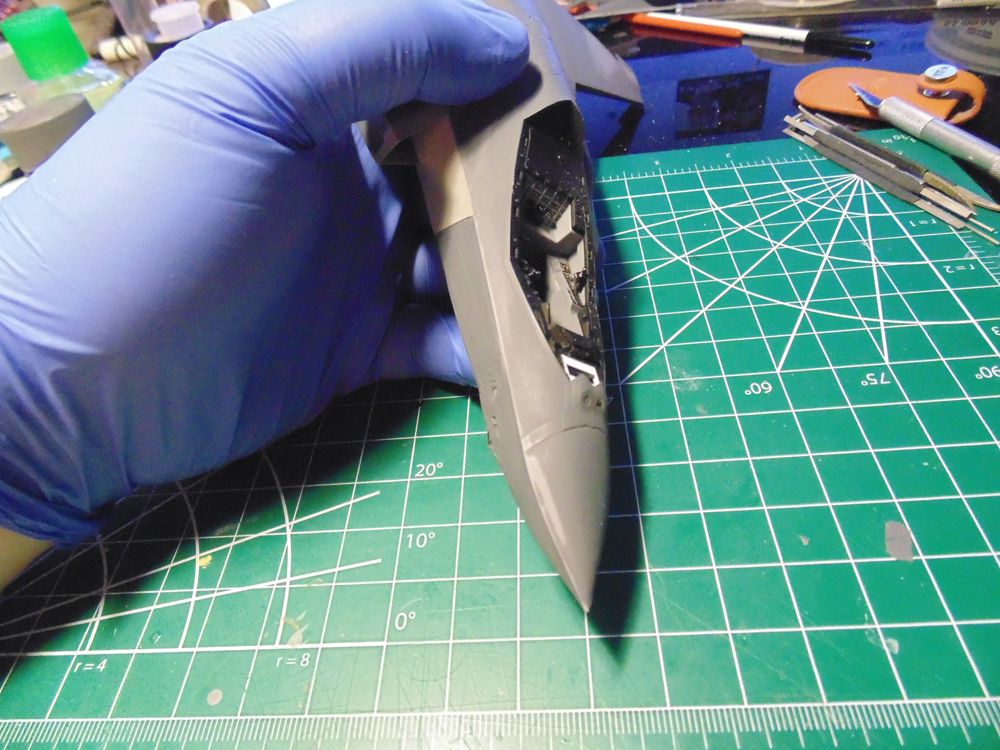 Holding the model near the cockpit