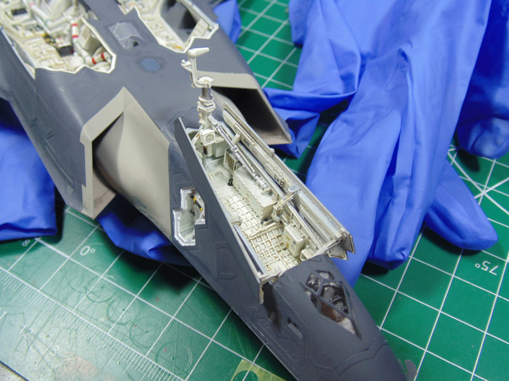 Front landing gear doors assembled with retraction arm
