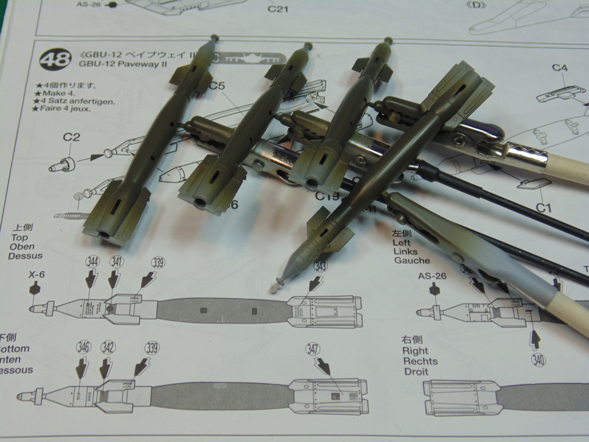 Four GBU ordinance models on painting sticks