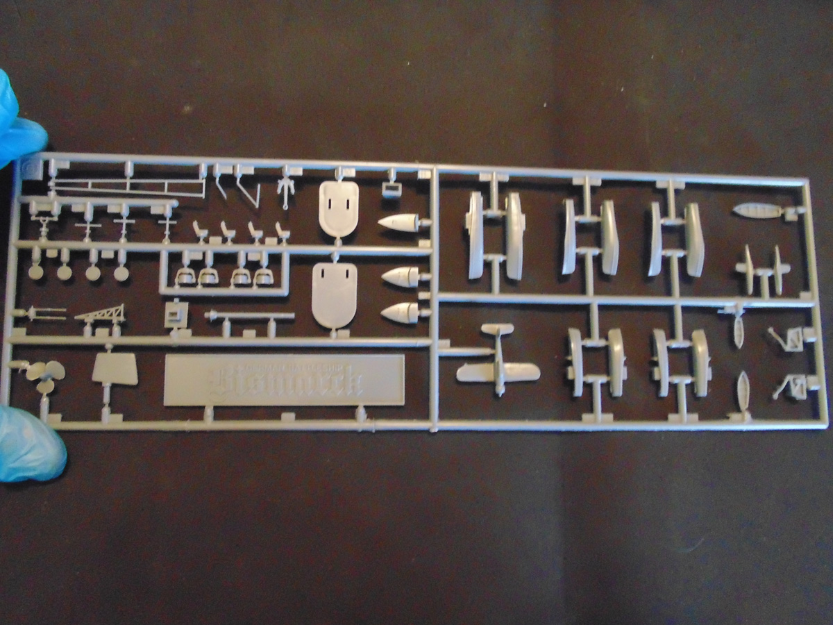 Blue glove holding the G sprue