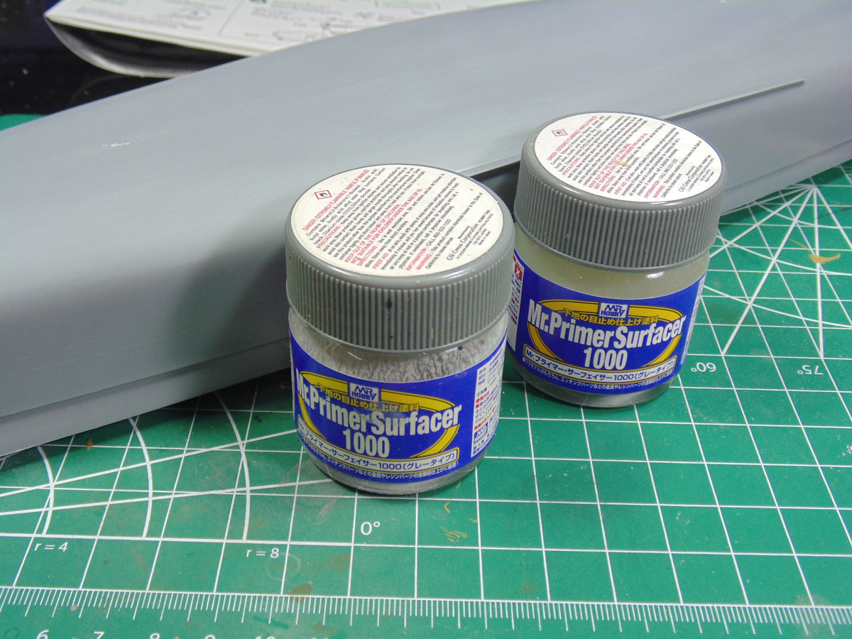 Two jars of primer with hull