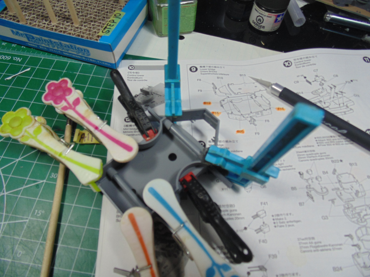 Clothes pins and clamps securing bridge parts