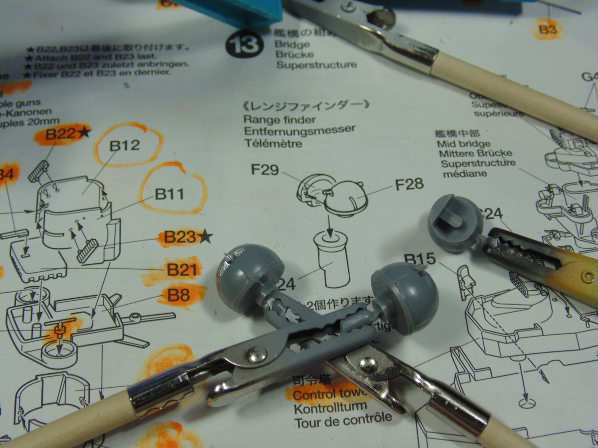 Sticks holding range finder parts