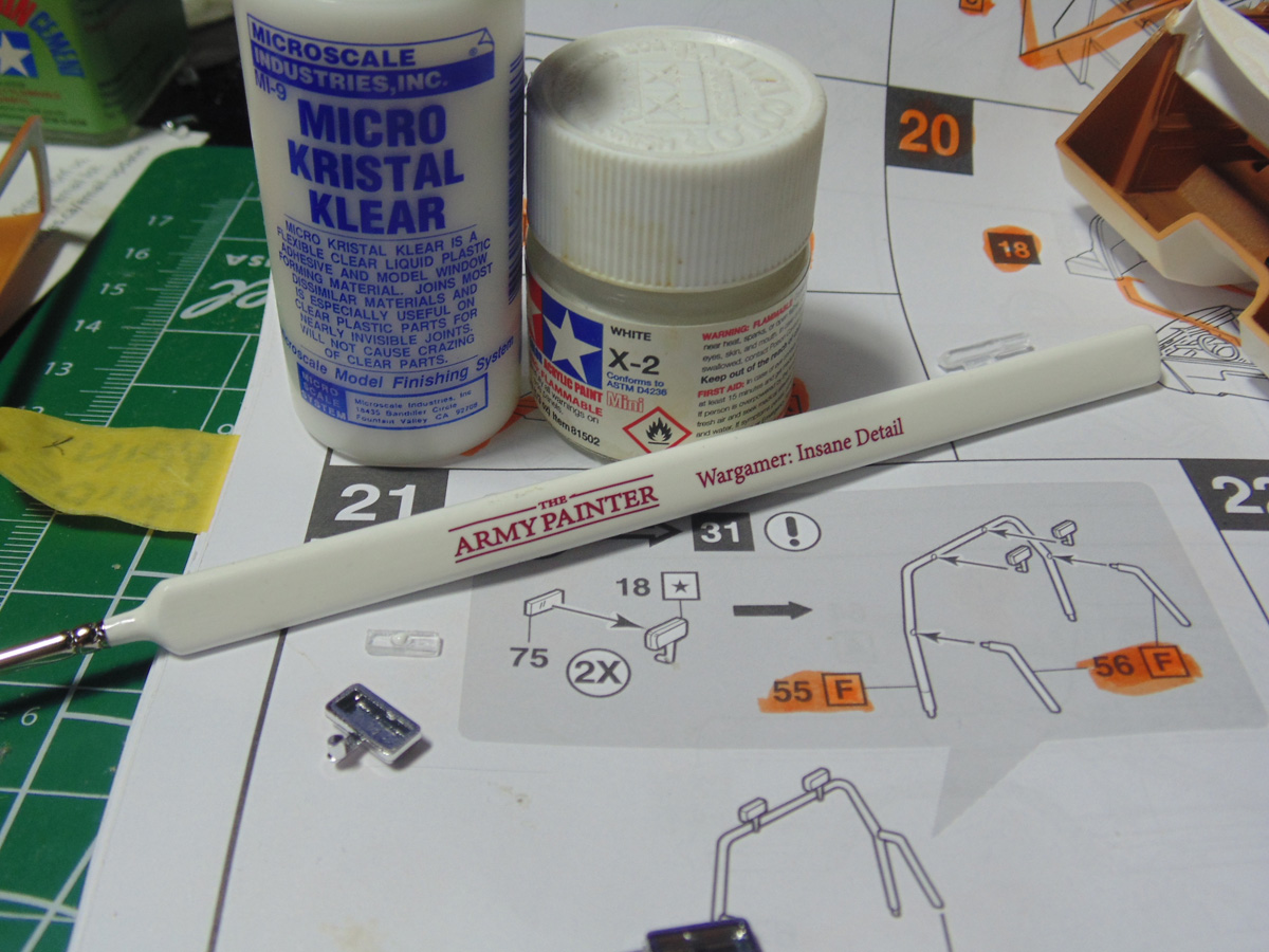 MKK above paint brush and parts
