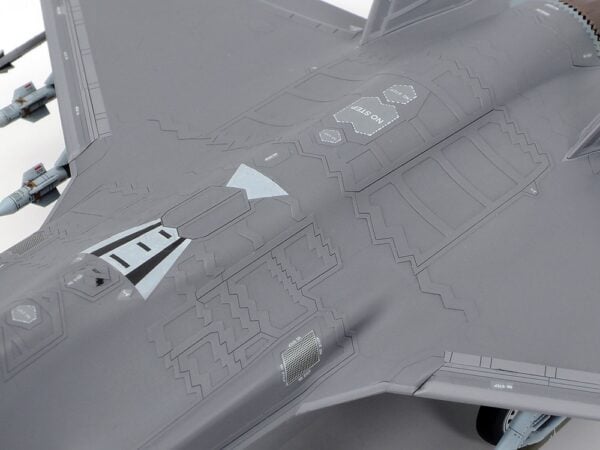 This model kit recreates the state-of-the-art F-35A Lightning II in 1/72 scale. It inherits many of the detailed features first seen in our 1/48 scale release. Thanks to extensive research, the A variant of the Lockheed Martin F-35 Lightning II is available to fans in either preferred scale. About the F-35A Fighter jets have continued to develop since they were first seen in late WWII, to the point where modern-day aircraft such as the F-35 Lightning II and F-22 Raptor are often called "fifth generation" fighters; qualities such as their highly advanced stealth characteristics and network connectivity set them apart from earlier fighters. Developed under the Joint Strike Fighter Program (JSF), the F-35 integrates multiple functions into its design and there are three types at the time of writing: the F-35A conventional take-off and landing (CTOL) aircraft, the F-35B short take-off, vertical landing (STOVL), and the F-35C, with its larger wing and tail; across these three variants, the F-35 can accomplish various missions without impacting upon its observability and exemplary maneuverability. Multiple sensors are at the heart of its advanced capabilities, and the wealth of data harvested is shared via multifunction advanced data link, helping provide the crew with outstanding information via a large cockpit display and the helmet-mounted display system. The F-35's maiden flight was in December 2006, and deployment with air arms in the U.S., Italy, Japan, and more is planned, as the aircraft appears set to take on a key role in the defense landscape in years to come. • 1/72 scale plastic model assembly kit. Wingspan: 148mm, fuselage length: 218mm. • Features refined molded depictions of radar absorbent material (RAM) sections on the surface. • This kit can be assembled with one choice of the three ordnance patterns – stealth mode, air-to-air mode, and beast mode. • Ordnance components can be attached to the weapons stations on the belly of the aircraft. • (Weapons bay door can only be attached closed.) • The fuselage with integrated wing has a realistic rendering of Blended Wing Body (BWB). • This kit also features realistic renderings of the following sections: - Y- shaped air intakes - Cockpit and landing gear bays - Engine nozzle (one-piece design) - Martin-Baker US16E ejection seat - RCS (radar cross section) enhancers affixed to top and bottom sections (two for each, four in total) during basic training exercises. - Boxes stored in nose landing gear bay. • Choose from open or closed canopy (not interchangeable after assembly). • Flaps are assembled in the up position. • Canopy and EOTS sensor fairing on nose undersurface are recreated in transparent plastic. • Includes a realistically recreated seated pilot figure with Helmet-Mounted Display (HMD) and ordnance components (AIM-9X Sidewinder x2 and GBU-12 Paveway II x4). • Comes with three marking options: • 34th FS, 388th FW, U.S. Air Force Air Combat Command, Hill AFB, Utah • 301st Fighter Squadron, 3rd Wing, Japan Air Self-Defense Force, Misawa Air Base 302nd Fighter Squadron, 3rd Wing, Japan Air Self-Defense Force, Misawa Air Base • Includes masking stickers for painting demarcation of canopy and EOTS sensor fairing components, and a full-color painting guide.